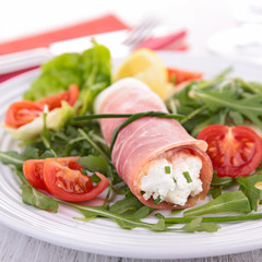 vegetable salad and ham rolled with cheese