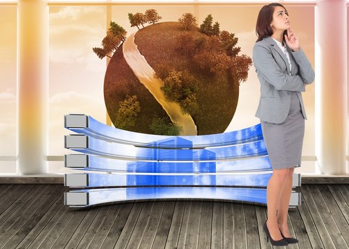 Composite image of focused businesswoman