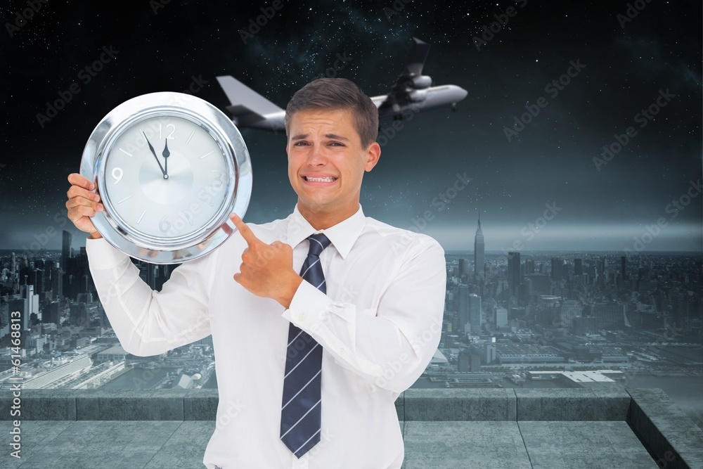 Aufkleber composite image of anxious businessman holding and showing a