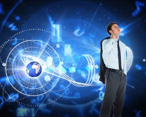 Composite image of serious businessman holding his jacket