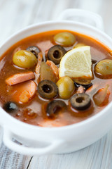 Close-up of russian traditional soup solyanka, vertical shot