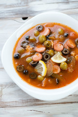 Solyanka soup made of various meat and vegetables, above view
