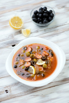 Solyanka - russian soup served with lemon and olives