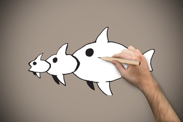 Composite image of hand holding a pencil