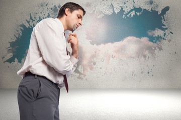 Composite image of thoughtful businessman holding pen to chin