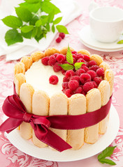Cake "Charlotte" with raspberries and cream, selective focus.
