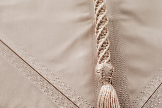 Detailed stitching of Kandura, the ankle-length garment
