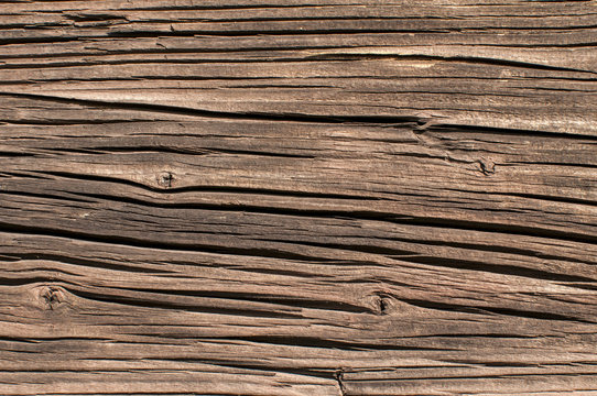 Old weathered wooden railway wagon board closeup as background