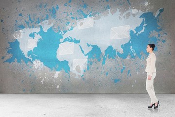 Composite image of unsmiling asian businesswoman walking