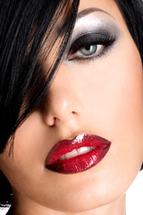 Naklejka premium Beautiful woman with sexy red lips and eye makeup
