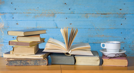 vintage books with coffee cup and specs, free copy space