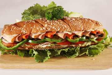 Chicken and Turkey Ham Sandwich with vegetables, brown bread