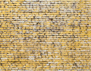 Old yellow brick wall background photo texture