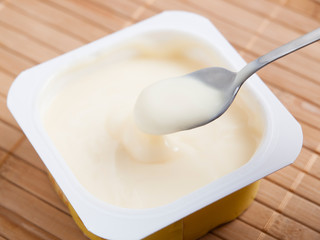 Spoonful of custard detail in a studio shot