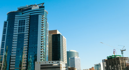 Office buildings against blue sky