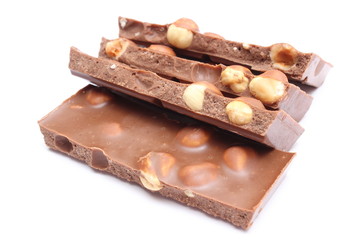 Closeup of chocolate pieces on white background