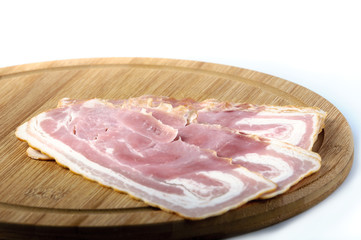 sliced pork bacon on wood