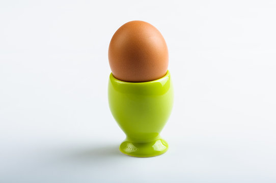 Green egg cup  on white background