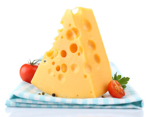 Piece of cheese and tomatoes,on color napkin, isolated on white