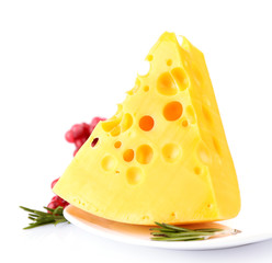 Piece of cheese with grape and rosemary