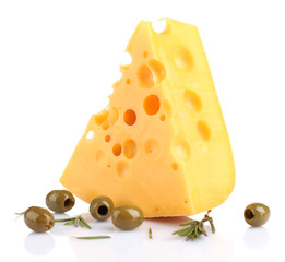 Piece of cheese with green olives, isolated on white