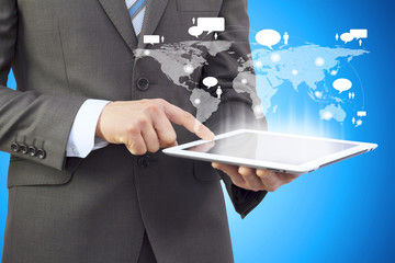 Businessman in a suit holding a tablet computer