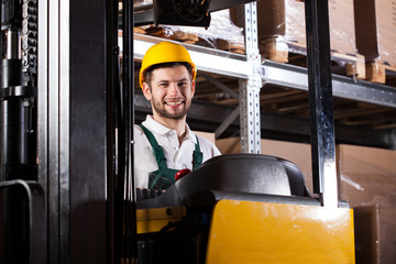 Warehouse worker on forklift