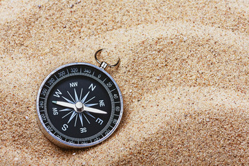 compass on the hot sand