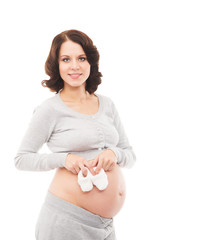 A happy pregnant woman isolated on white