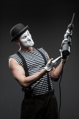 mime with hammer drill
