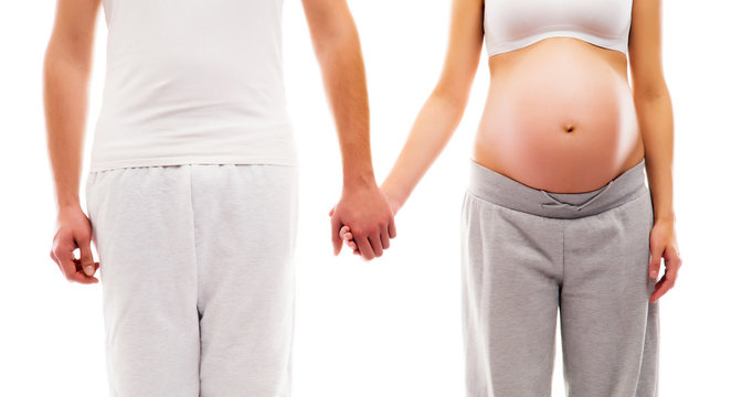 Young attractive couple: pregnant mother and a father