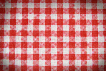 Texture of a red and white checkered picnic blanket.