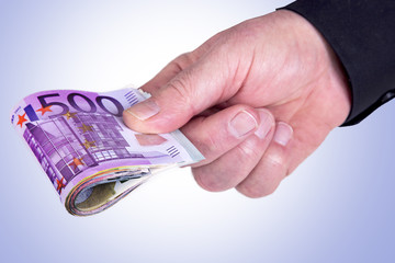 Hand holding bunch of cash
