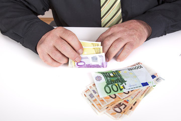 Successful businessman counting his money