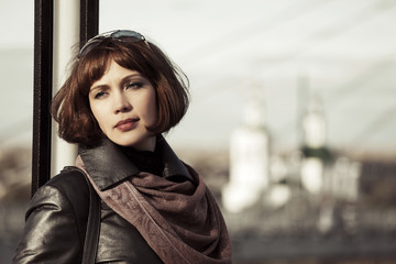 Sad beautiful young woman daydreaming outdoor