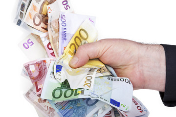 Hand holds bunch of crumpled cash