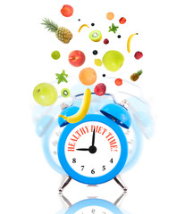 Diet concept with clock, scale dial and fruits