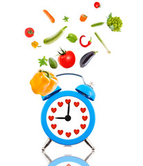 Diet concept, alarm clock ringing,hearts and fruits