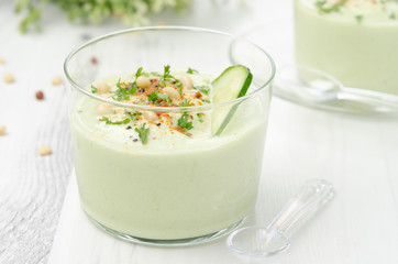 cold soup with avocado, cucumber and yogurt in a glass beaker