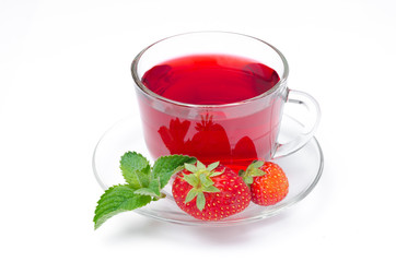 cup of red tea with strawberries and mint on a white background