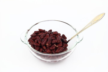 The bean in glass dish on the white background