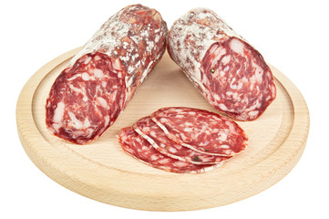 delicious salami on wooden plank