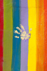 pride flag with hand print