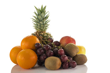 fruit as oranges pineapple grapes and kiwi