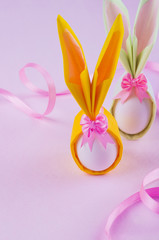 Two bunny nupkin eggs on pink background