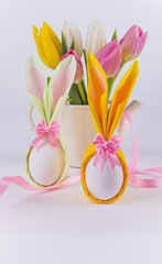 Bunny napkin eggs for easter and flowers on white background