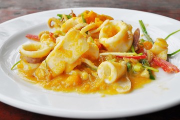 Stired squid with salty egg sauce and red chili