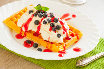 Waffles with fruits and whipped cream