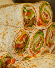 tasty rolls of pita stuffed with fish(shallow depth of field)