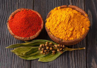 Spices curry, bay leaf and paprika. Spice over Wood.